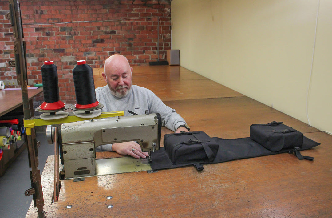 Load image into Gallery viewer, The Freerein Equipment saddle bags in creation, image shows the maker sewing a seam
